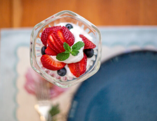 Overhead image of strawberry-blueberry yogurt parfait.