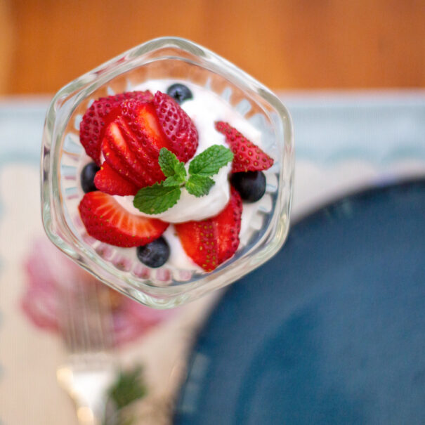 Overhead image of strawberry-blueberry yogurt parfait.
