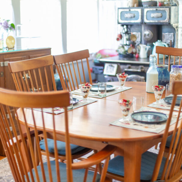Dining room table set for four for breakfast.