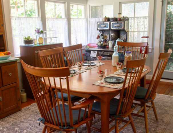 Dining room table set for four for breakfast.