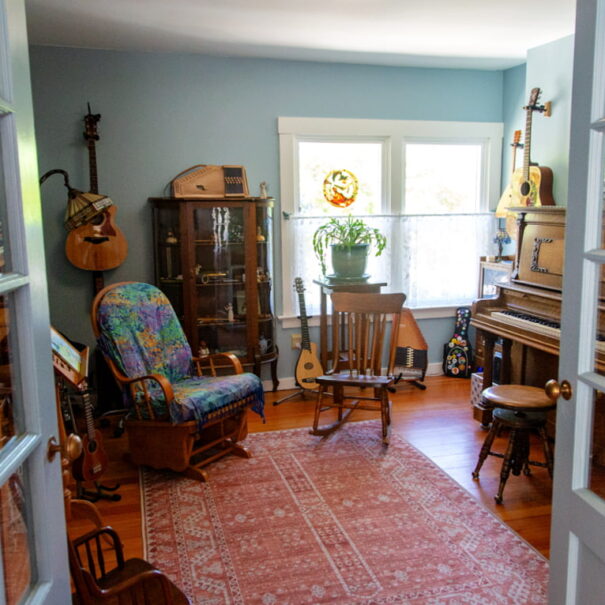 Interior of music room. Piano, guitars, etc.