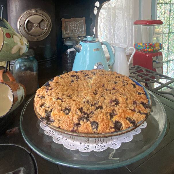Blueberry buckle baked in a large pie dish.